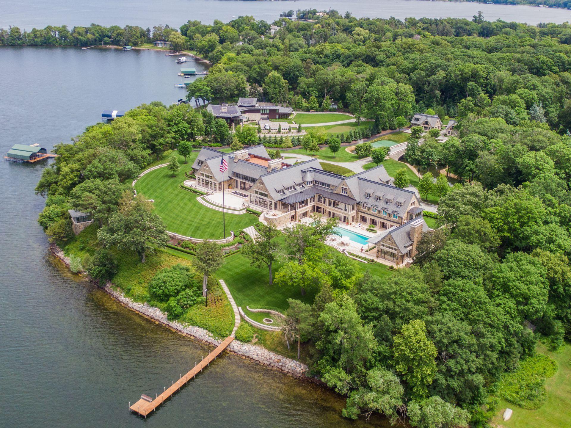 Aerial view of a waterfront estate with a private dock in Wayzata, Minnesota